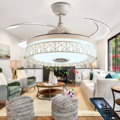 a ceiling fan with musical notes hanging from it's blades in a living room