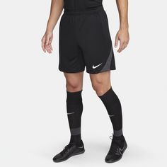 a man in black soccer shorts and socks