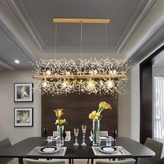 a dining room table and chairs with flowers in vases on the centerpiece above it