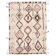 an old rug with fringes and diamonds on the bottom, in pink tones against a white background