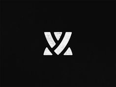 a black and white logo with the letter v in it's center, on a dark background