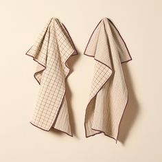 two pieces of cloth folded on top of each other, one in the shape of a rectangle