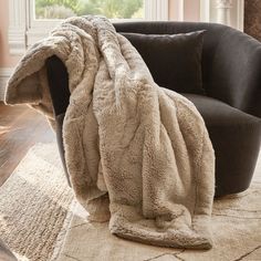 a chair with a blanket on top of it