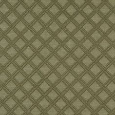 an upholstered green fabric with small squares