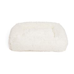 a white dog bed on a white background