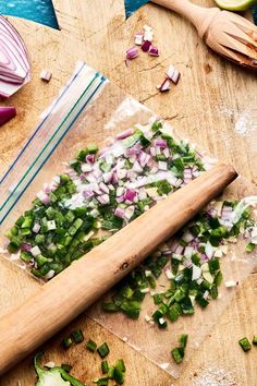 chopped up vegetables on a cutting board next to a knife