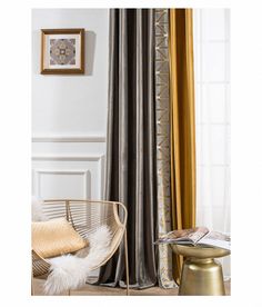 a living room with gold and silver curtains