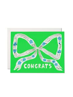 a green greeting card with the words congrats in white and blue flowers on it