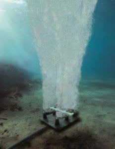 an object floating in the water on top of some dirt and sand with sunlight coming through it