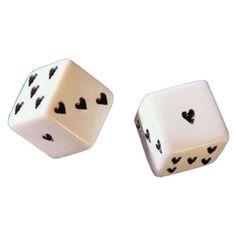 two white dices with black hearts on them