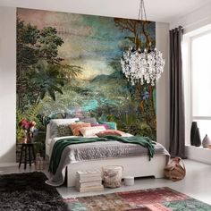 a bedroom with a bed, chandelier and large mural on the wall behind it