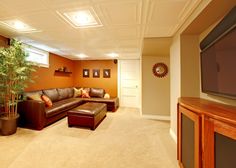 a living room filled with furniture and a flat screen tv