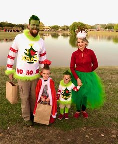 a man and two children dressed up in costumes