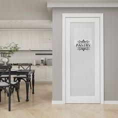 a dining room table and chairs in front of an open door with the pantry logo on it