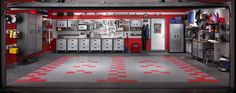 a garage with red and white checkered flooring on the walls, cabinets and appliances