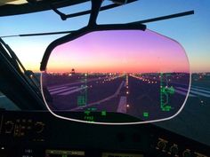 an airplane's view from the cockpit as it is about to take off at sunset