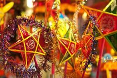 many colorful decorations are hanging on sticks