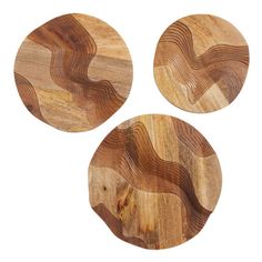 three wooden plates with wavy designs on them