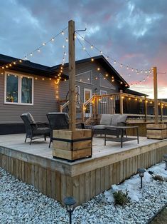 a deck with chairs and lights on it