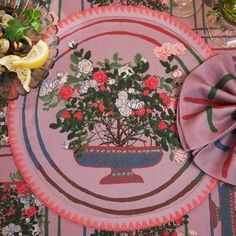 a pink placemat with flowers on it