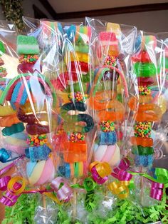 candy candies are wrapped in plastic bags and placed on top of each other for display