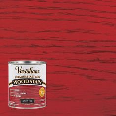 a red wood stain is being used to paint