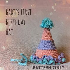 a crocheted birthday hat with the words babies first birthday hat