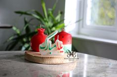 two birthday candles sitting on top of a table