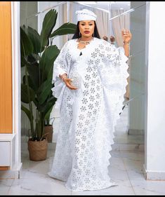 Boubou lace gown Lace Butterfly Bubu Gown Styles, White Lace Boubou Styles For Women 2022, Dry Lace Bubu Gown Styles Nigerian, Boubou Styles For Women Lace, Elegant White V-neck Thobe, Elegant Long Dress With Lace Patchwork, Lace Boubou Gown Style, Elegant Long Dress With Lace Work, White Maxi-length Kaftan For Evening