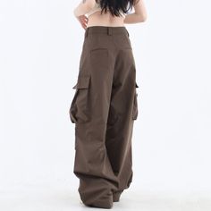 These classic-style brown pants feature a wide fit with cargo pockets Size: • S: Waist: 62cm/ 24.4 in, Length: 100cm/ 39.4 in• M: Waist: 66cm/ 26.0 in, Length: 101cm/ 39.8 in• L: Waist: 70cm/ 27.6 in, Length: 102cm/ 40.2 in• XL: Waist: 74cm/ 29.1 in, Length: 103cm/ 40.6 in• XXL: Waist: 80cm/ 31.5 in, Length: 104cm/ 40.9 inMaterial: Cotton, Polyester Baggy Brown Bottoms With Side Pockets, Brown Baggy Bottoms With Side Pockets, Baggy Brown Cargo Style Bottoms, Baggy High Waist Brown Parachute Pants, Brown Baggy Cargo Style Bottoms, Brown Baggy Full-length Cargo Pants, Baggy Brown Long Pants, High Waist Brown Cargo Pants For Streetwear, Brown Baggy High Waist Cargo Pants