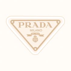 a white sticker with the words prada in gold on it's side