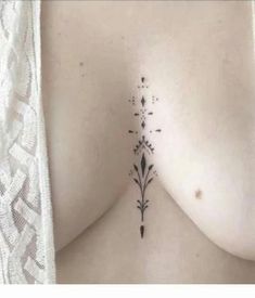 the back of a woman's breast with flowers on it