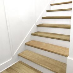 some wooden stairs in a white room