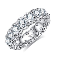 a white gold ring with rows of diamonds