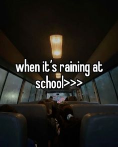 the inside of a bus with people sitting in it and texting when it's raining at school > >