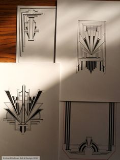 three black and white art deco prints on paper with shadows from the light shining through them