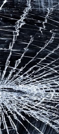 an image of broken glass that is black and white