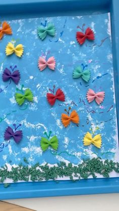 a blue tray filled with lots of different colored bows