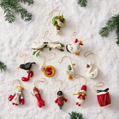 christmas ornaments are laid out in the snow