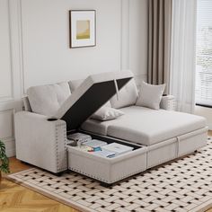 a living room with a couch that has an open pull out bed in the middle