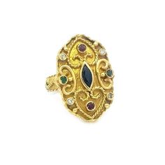 This is a lovely vintage byzantine style ring, it is crafted from 18k yellow gold featuring a long shape top with a marquise stone in the center surrounded with small bezel set ruby and emerald and diamonds. The flat surface show a fine wire rope scroll to heart shape design. It is stamped 750. Material: 18k yellow gold Main Stone:  diamond Gemstone:  colored stones Measurement:  top: 25mm long x 17mm wide x 7mm high Weight: 8.4 grams Stock# 70115 Track Page Views With Auctiva's Counter Byzantine Ring, Etruscan Jewelry, Byzantine Gold, Byzantine Rings, Heart Shape Design, Colored Stones, Flat Surface, Shape Design, Diamond Gemstone