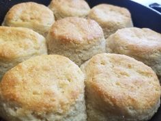 a pan filled with biscuits sitting on top of a stove