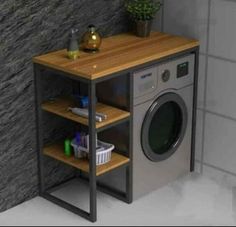 a laundry room with a washer and dryer next to a wall mounted shelf