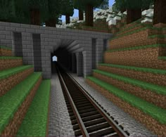 a train track going through a tunnel in minecraft