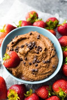 a bowl filled with chocolate and strawberries