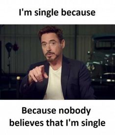 a man in a suit pointing at the camera and saying, i'm single because he