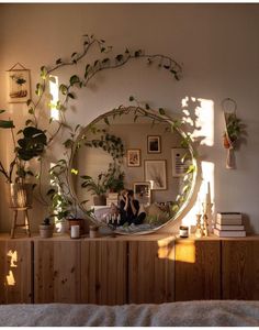 a woman taking a selfie in front of a mirror with plants on the wall