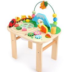 a child's wooden table with toys on it