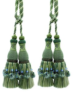 two green tassels with blue beads on them