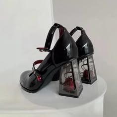 These Dark Romantic Gothic Rose High Heels are expertly crafted for fashion enthusiasts who appreciate dark aesthetics. With a combination of chunky, pump, and mary jane heel styles, these heels offer a unique and captivating design. The striking red and black color palette creates a mysterious and alluring vibe, making them perfect for goth, punk, or grunge looks. Made from vegan leather, these heels feature transparent block heels with real rose accents inside. The adjustable buckle ankle stra Gothic High Heels, Black Mary Jane Shoes, Mary Jane Platform Shoes, Zapatos Mary Jane, Punk Shoes, Mary Jane High Heels, Gothic Shoes, Cosplay Shoes, Mary Jane Heels